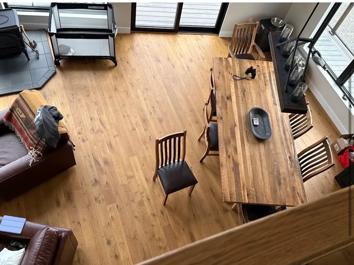 Overhead view of a lived-in room with an oak hardwood floor