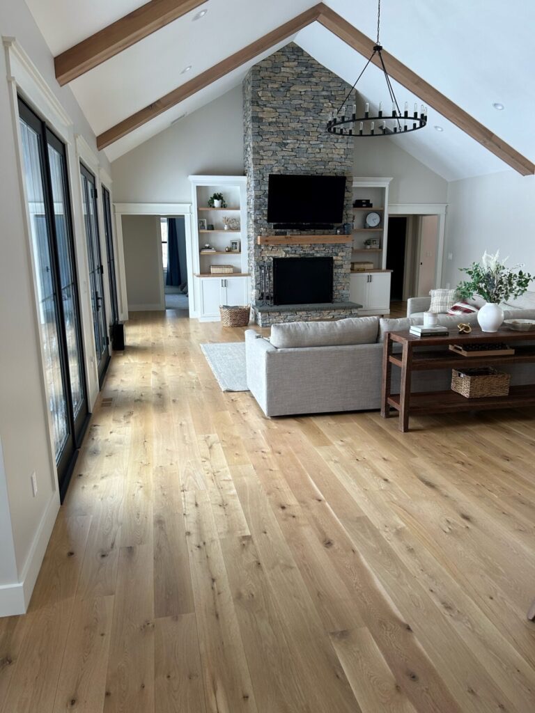 Wide plank white oak flooring in a vaulted great room