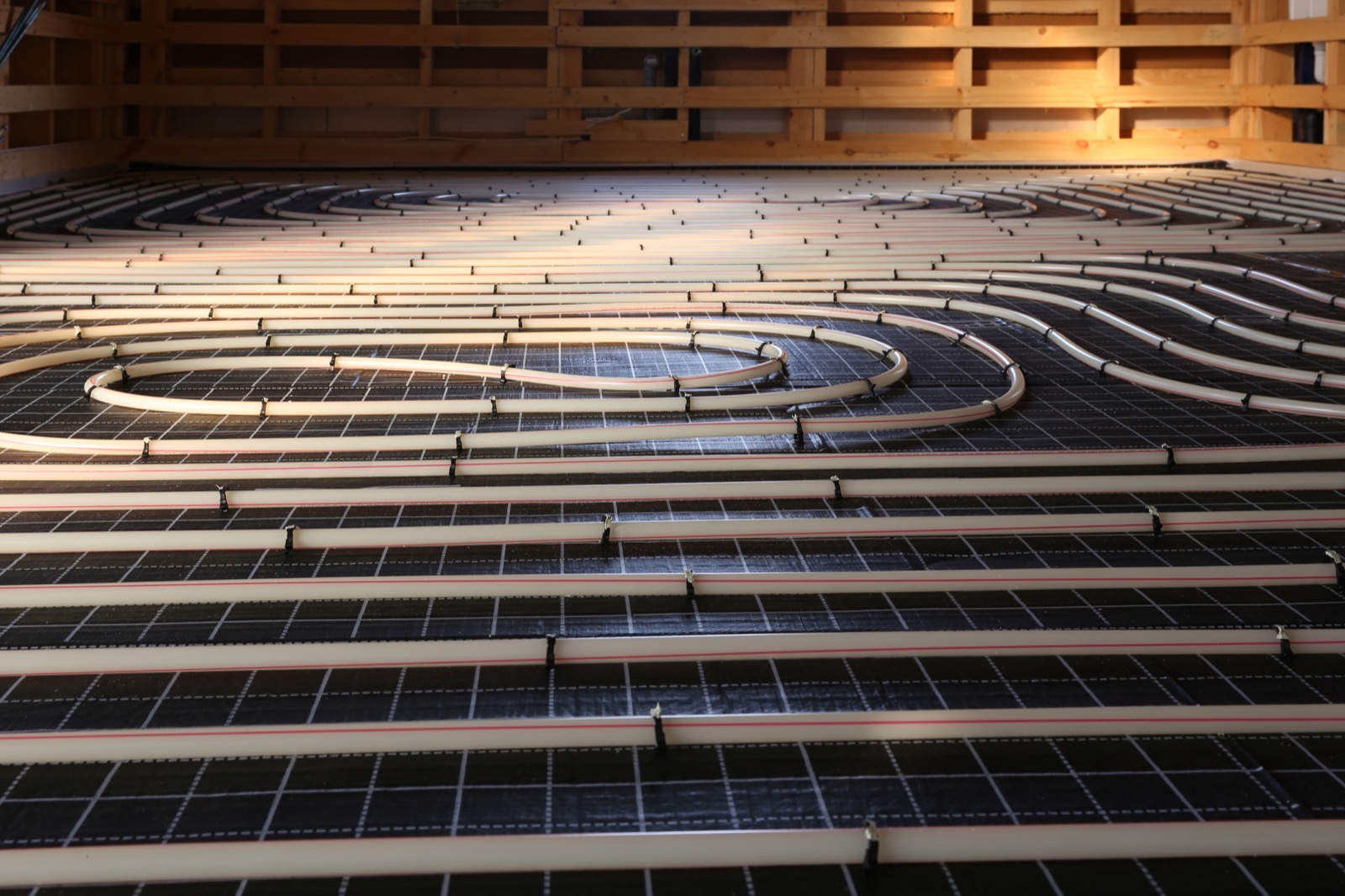 Radiant floor heating tubing installed during construction